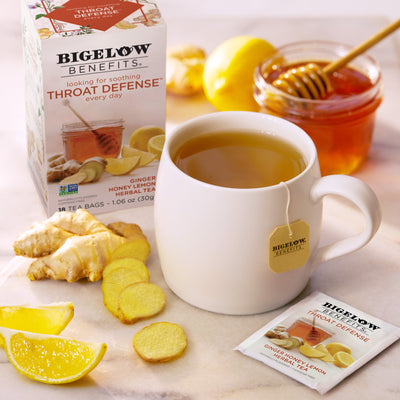 Box of Benefits Throat Defense Ginger Honey Lemon Herbal Tea and cup of tea